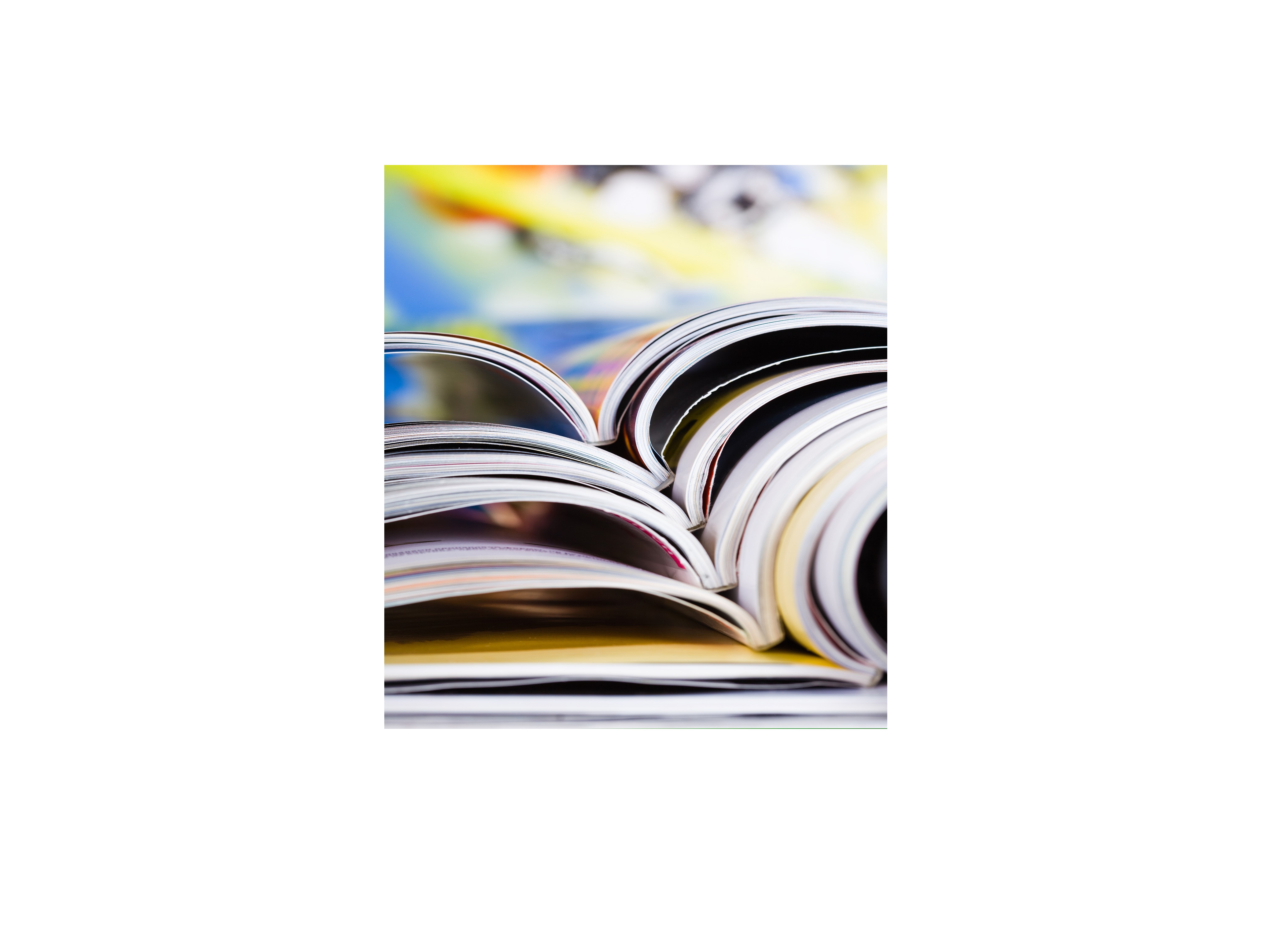 An image of books open laid on top of each other